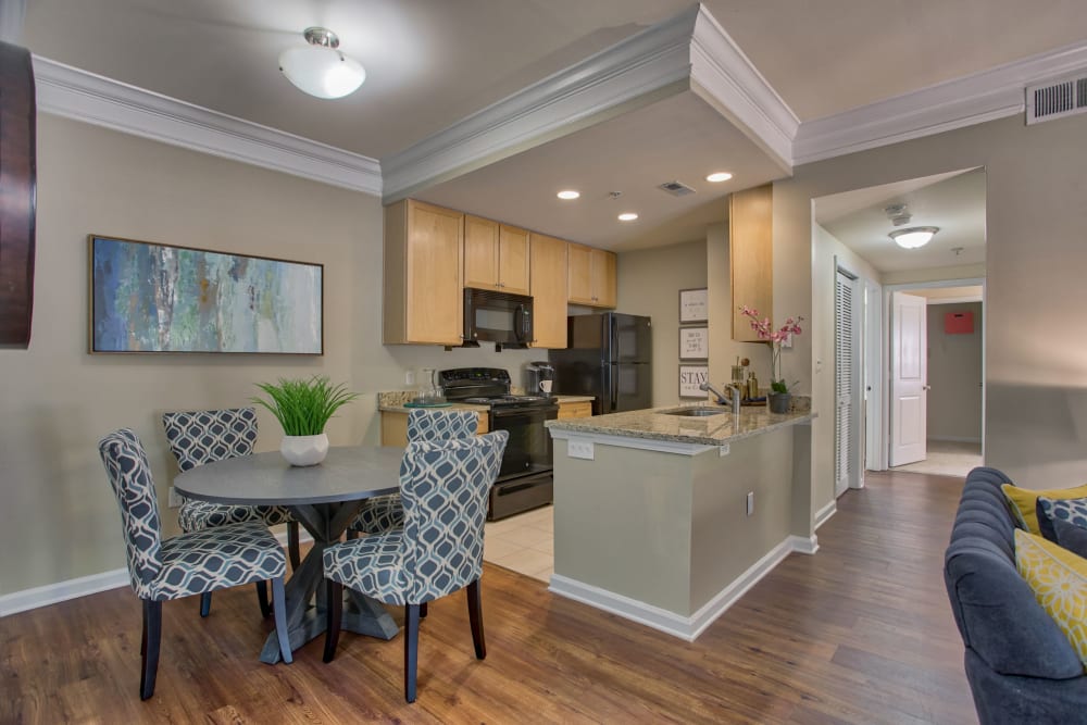 Dining area and breakfast bar next to kitchen at Atkins Circle Apartments & Townhomes in Charlotte, North Carolina