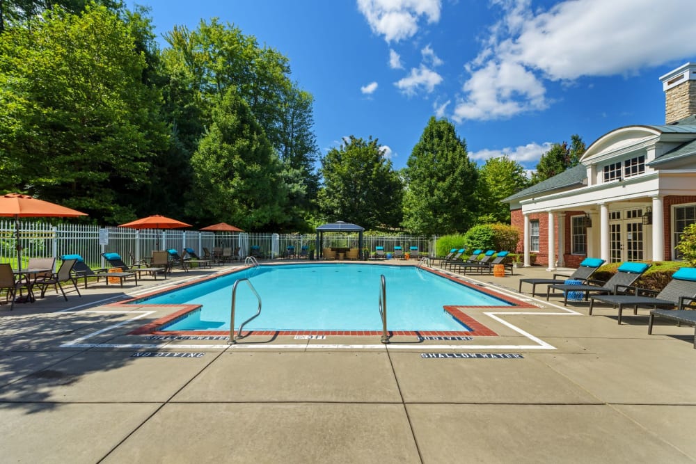 Swimming pool with lots of seating for residents at Christopher Wren Apartments & Townhomes in Wexford, Pennsylvania