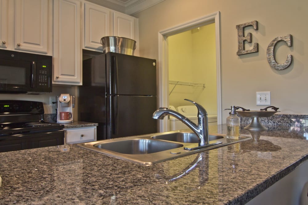 Kitchen with granite countertops in a home at Easton Commons Apartments & Townhomes in Columbus, Ohio