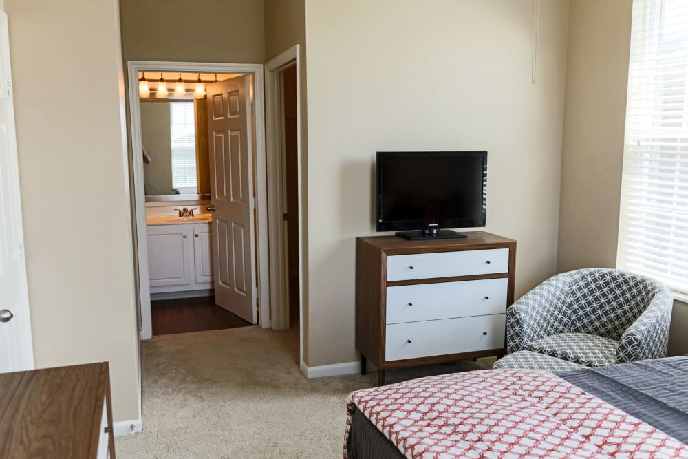Bedroom with tv at The Preserve at Beckett Ridge Apartments & Townhomes in West Chester, Ohio