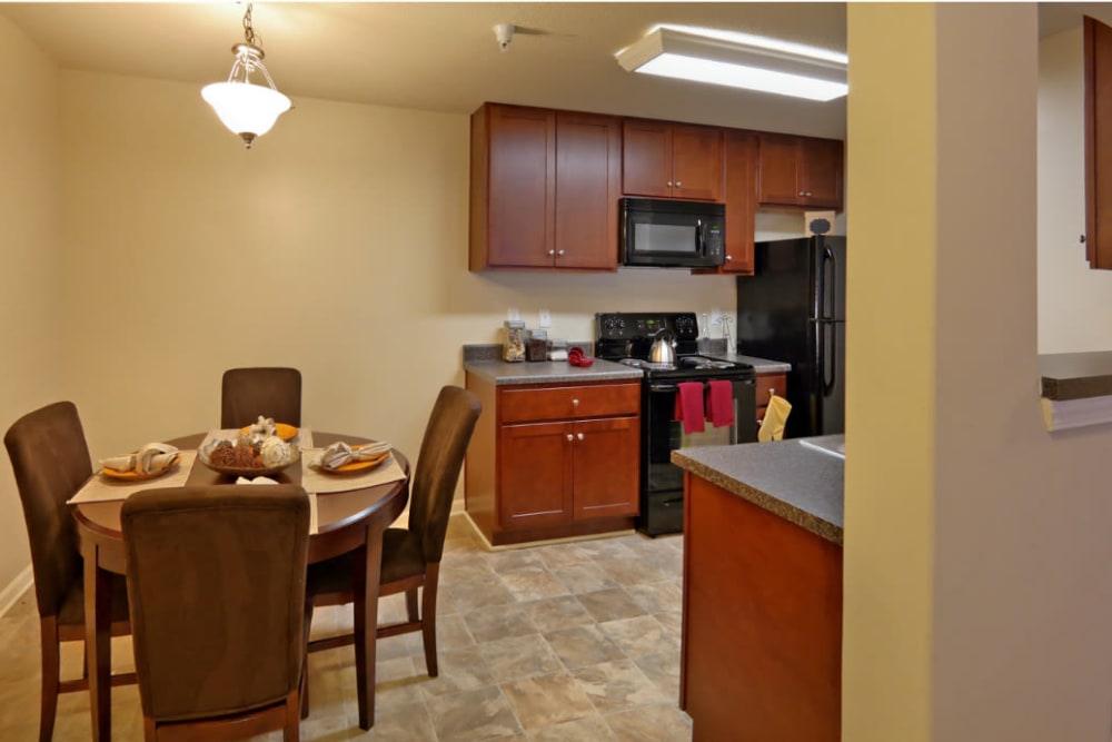 A dining room with hard flooring at Denbigh Village in Newport News, Virginia