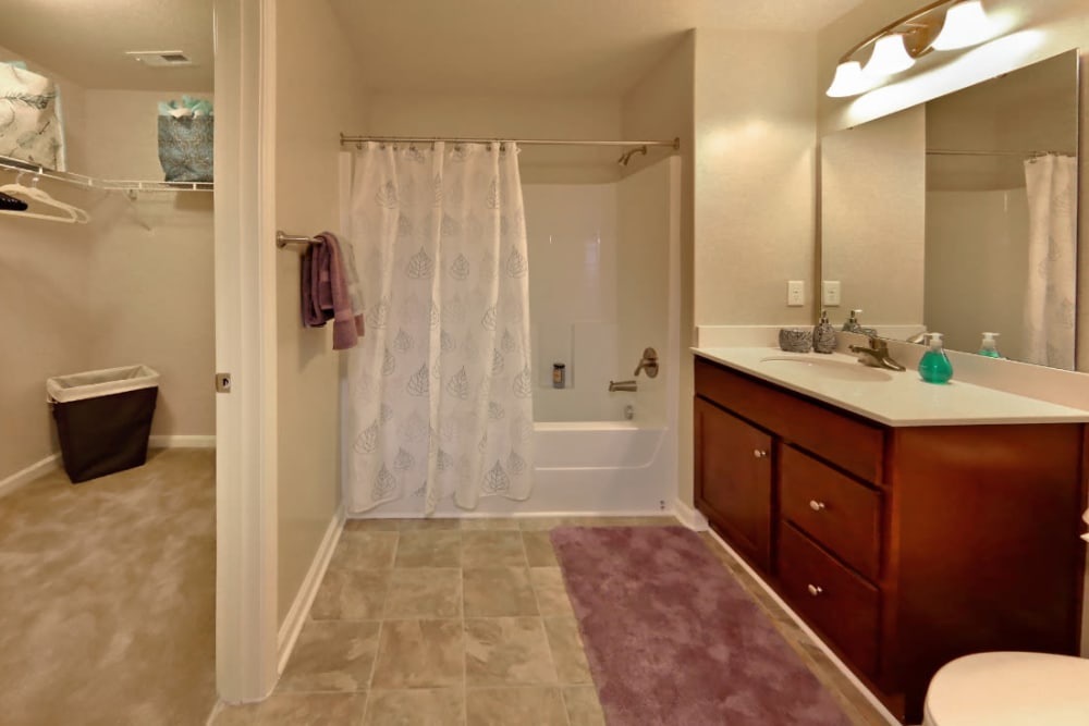 A large bathroom with an oval tub at Denbigh Village in Newport News, Virginia