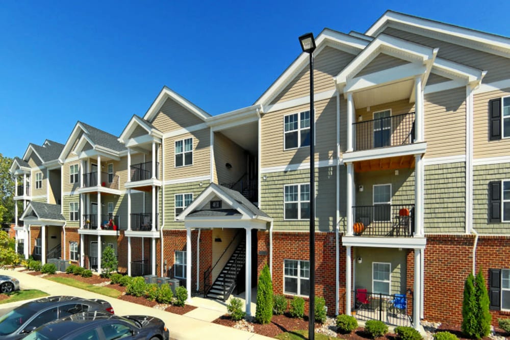 An exterior with beautiful landscaping at Denbigh Village in Newport News, Virginia