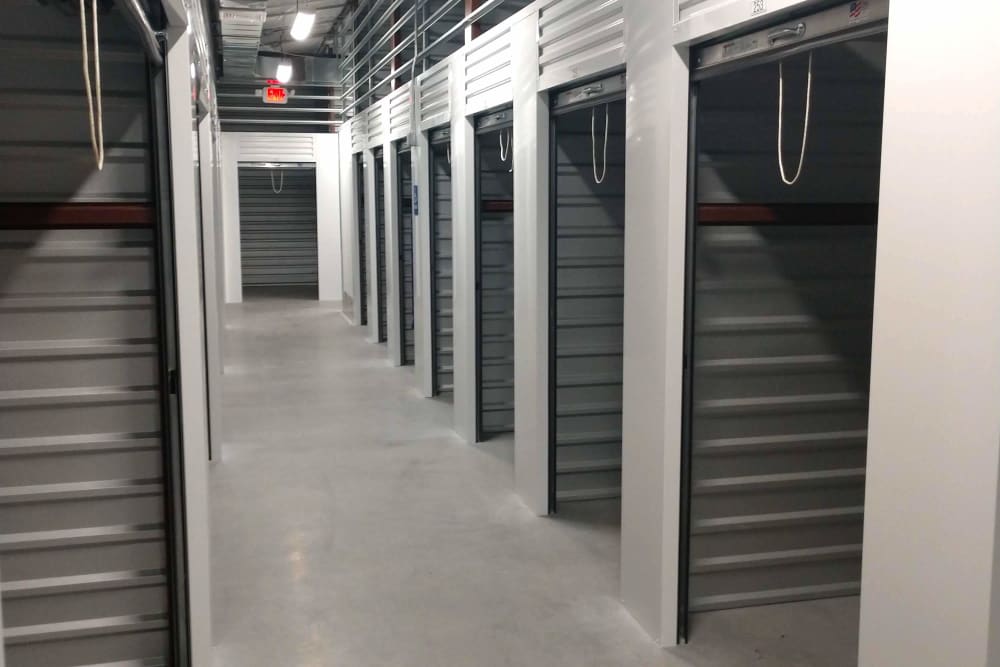 Row of indoor storage units at Global Self Storage in Millbrook, New York