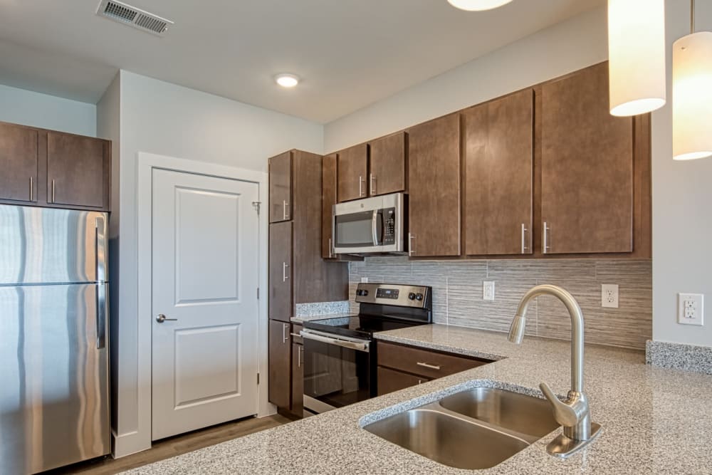 A kitchen with stainless-steel appliances at Marina Villa in Norfolk, Virginia