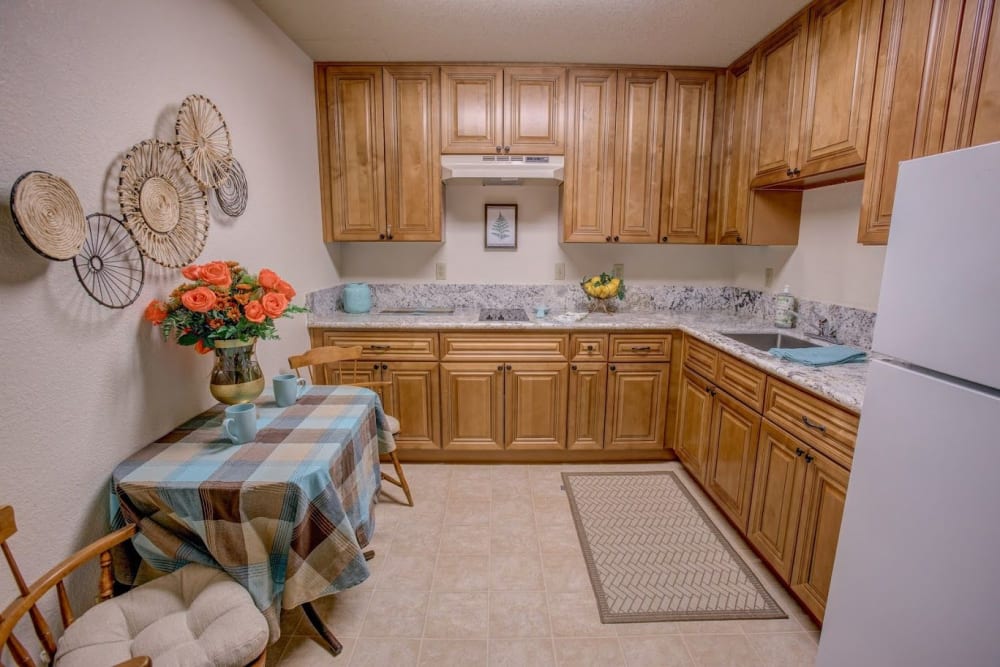 Kitchen with dining area at Golden Pond Retirement Community in Sacramento, California