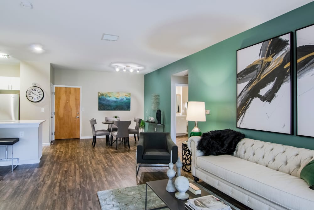 Bright, well-decorated living room at Summit at Flatirons Apartments in Broomfield, Colorado