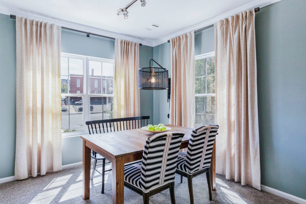 Cute dining area with tons of light at Sofi at Salem Station in Salem, Massachusetts