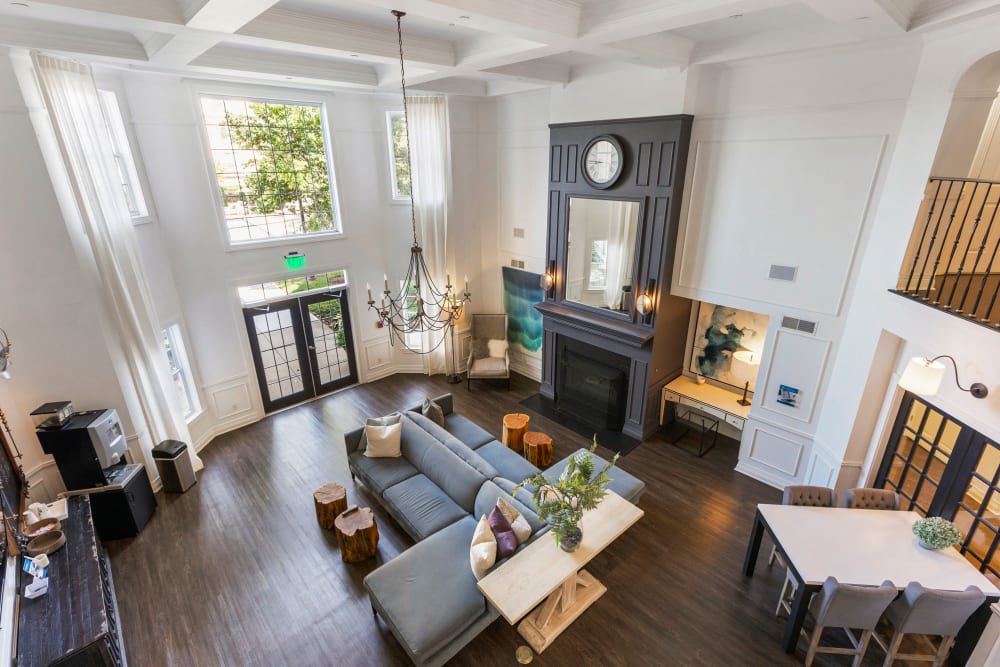 Overhead view of spacious clubhouse area where you can relax by the fireplace at Sofi at Salem Station in Salem, Massachusetts