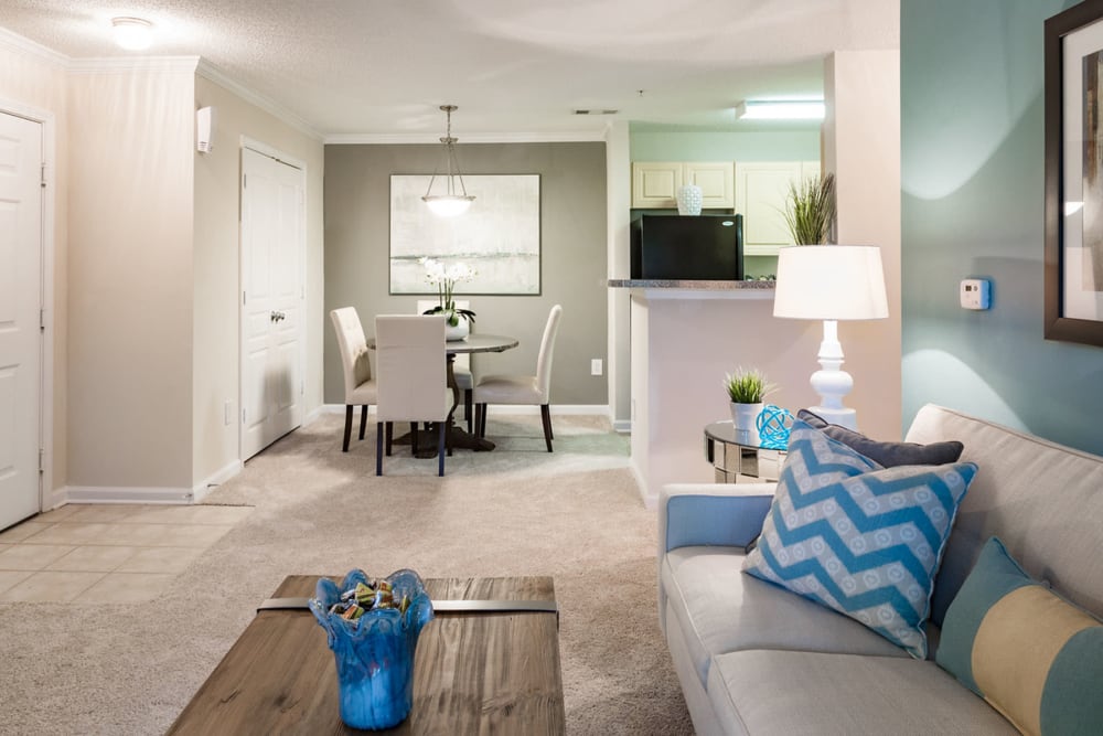 Spacious and well-furnished open-concept living area in a model home at The Vinings at Newnan Lakes in Newnan, Georgia
