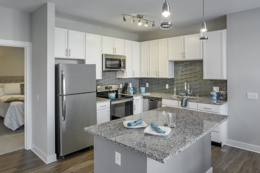 Spacious kitchen with granite counters at The Beacon at Gateway in Scarborough, Maine
