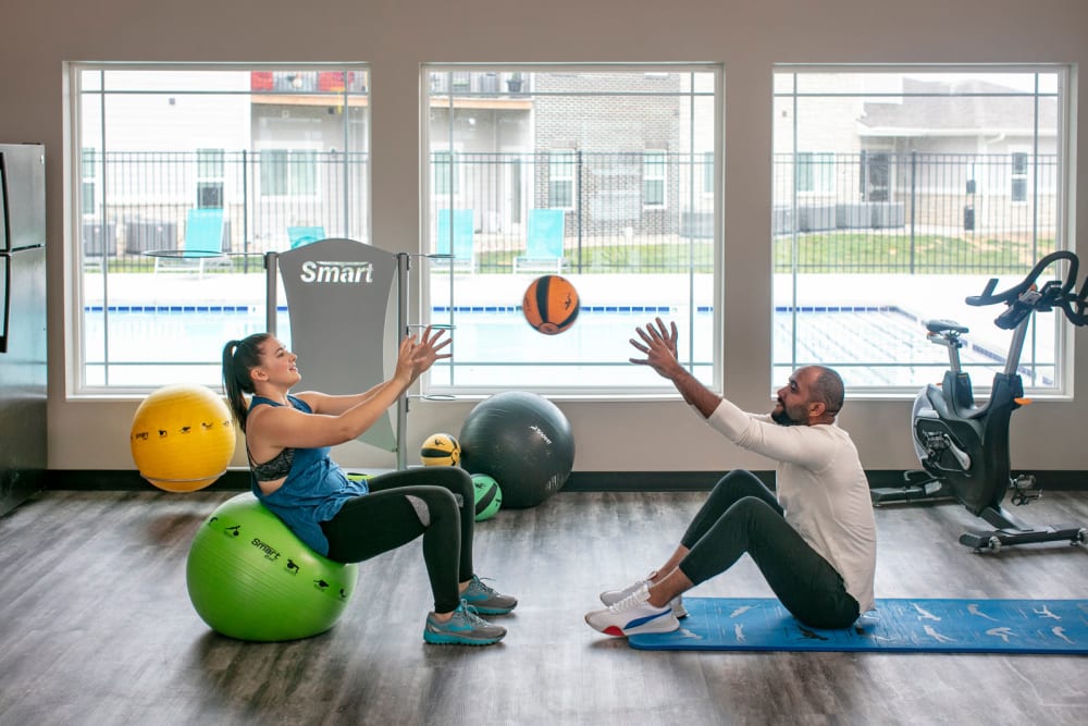 Resident tossing a medicine ball at Autumn Ridge in Waukee, Iowa