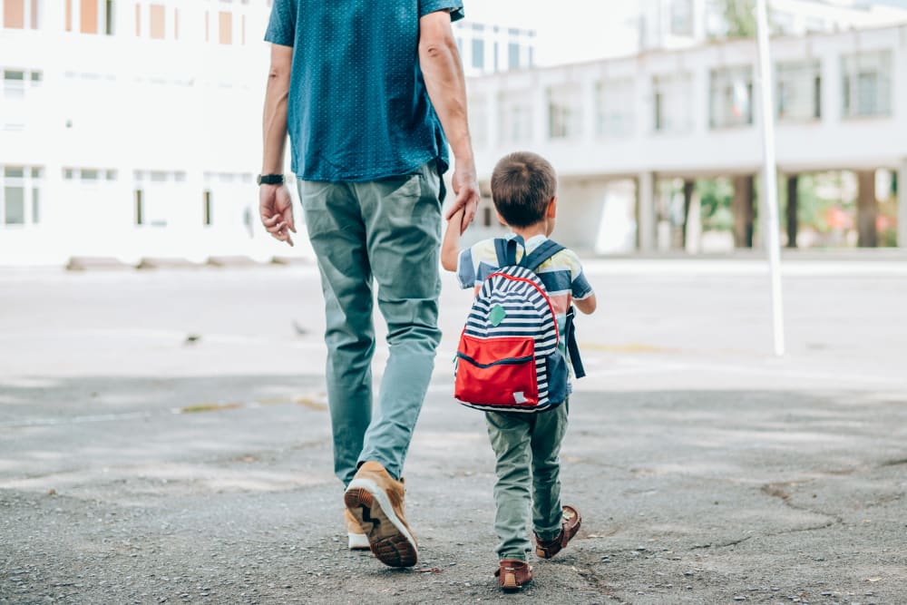 Resident walking their kid to school at Autumn Ridge in Waukee, Iowa