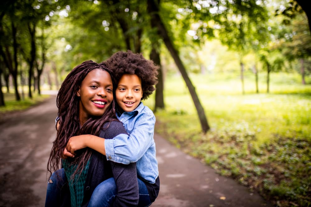 Resident and her child walking on a trail near Lakeview Residences in Aurora, Illinois