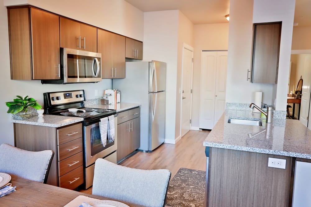 apartment kitchen with granite counter top The Boulevard in Philomath, Oregon