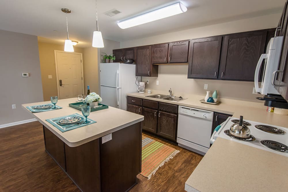 A kitchen with an island at Silver Lake Hills in Fenton, Michigan