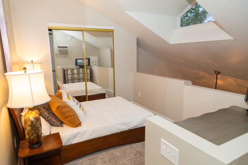 A bedroom with a skylight at Sunbrook Apartments in Saint Charles, Missouri