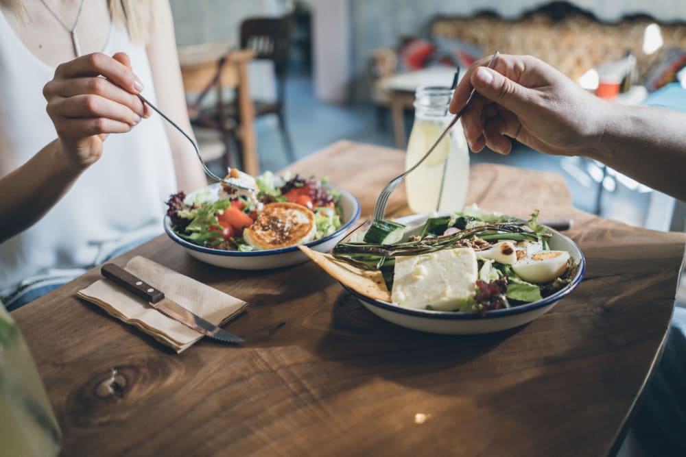 Residents enjoying a salad at Leisure Manor Apartments in Sacramento, California