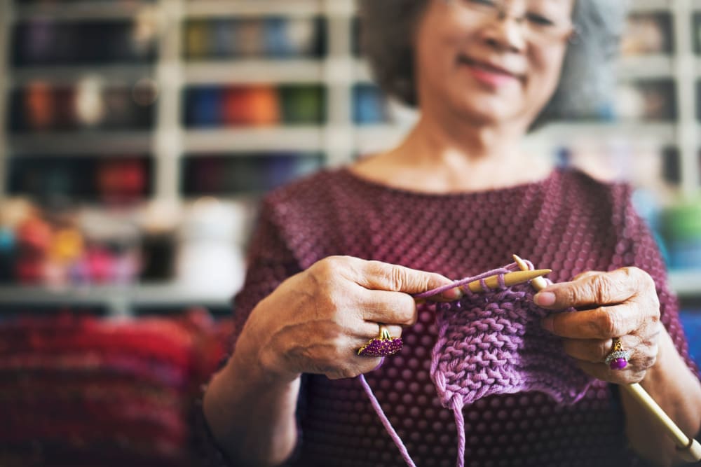 Resident knitting at Leisure Manor Apartments in Sacramento, California