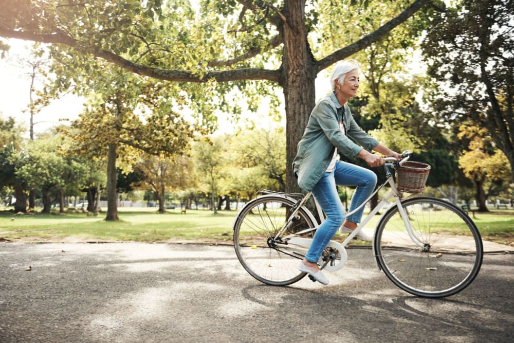 Resident riding their bike near Leisure Manor Apartments in Sacramento, California