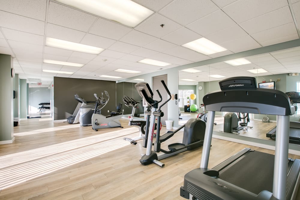 A fitness center with multiple stations at Provence Apartments in Burnsville, Minnesota