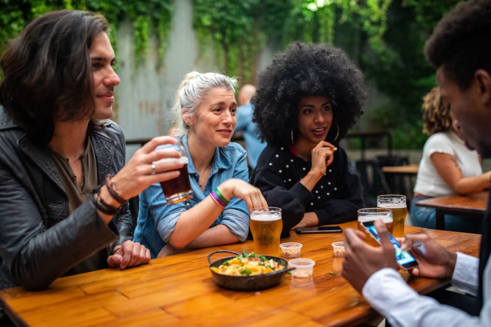 Friends having a beer near Foothill Terrace in Auburn, California