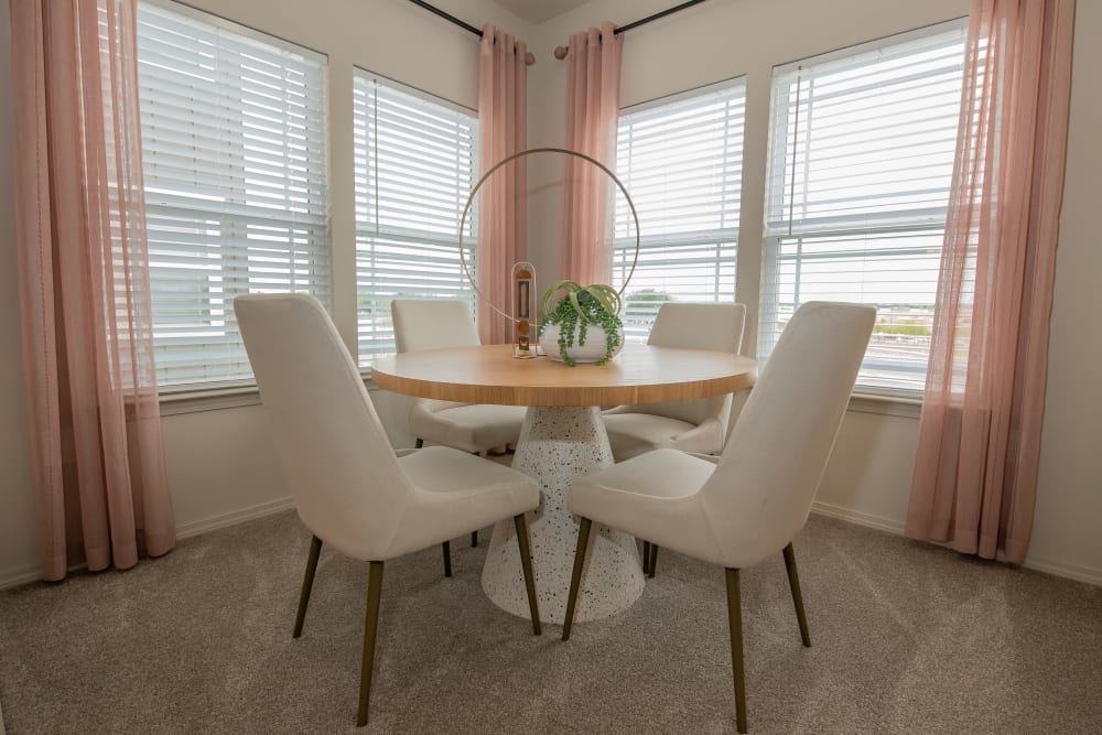 Dining area with large windows for lots of light at Artisan Crossing in Norman, Oklahoma