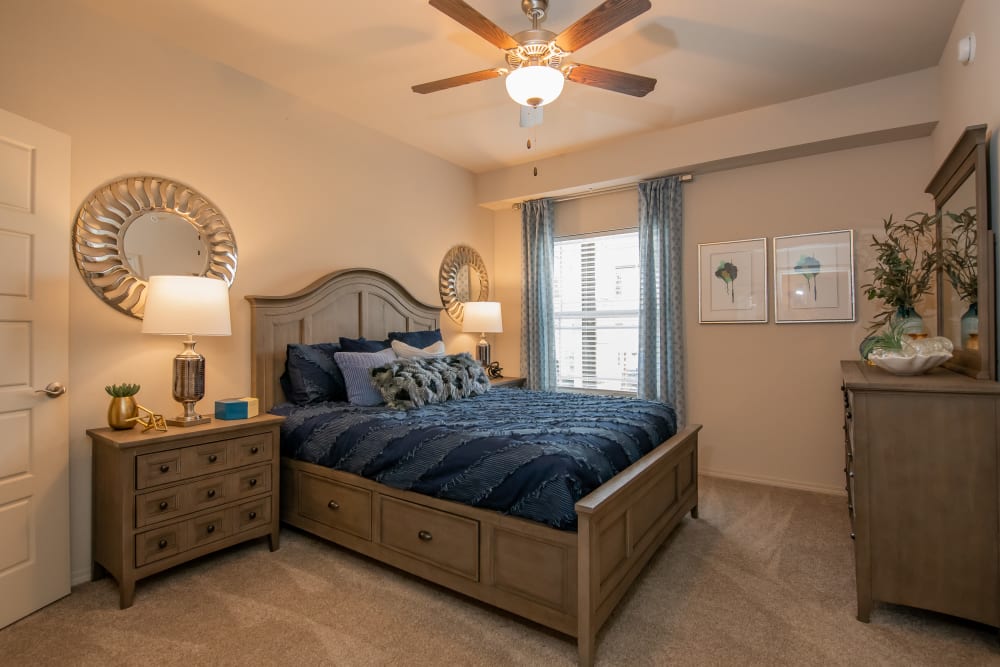Bedroom with ceiling fan at Artisan Crossing in Norman, Oklahoma