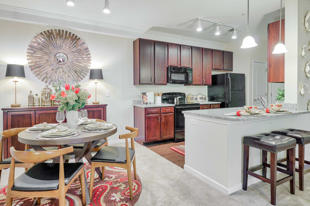 View of dining area into kitchen at Oasis at Montclair Apartments in Dumfries , VA