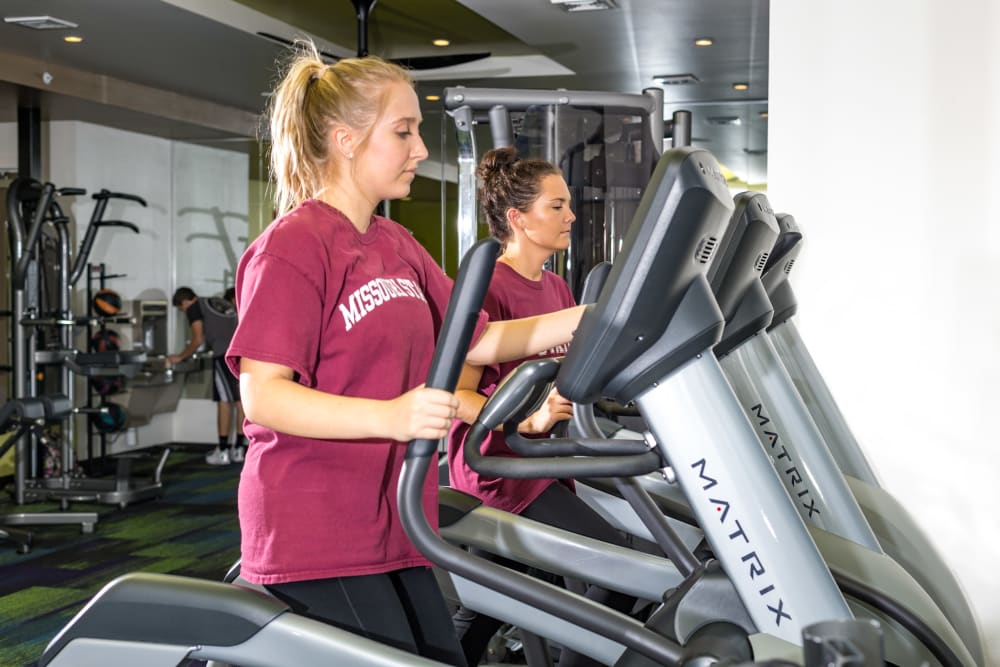 Resident using an elliptical at Beacon Springfield in Springfield, Missouri