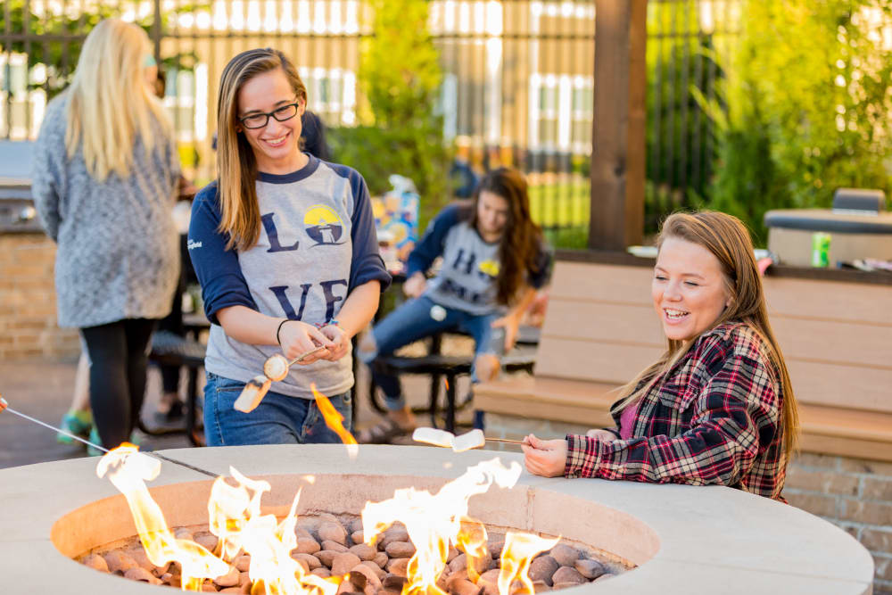 Residents hanging out around the fireplace at Beacon Springfield in Springfield, Missouri