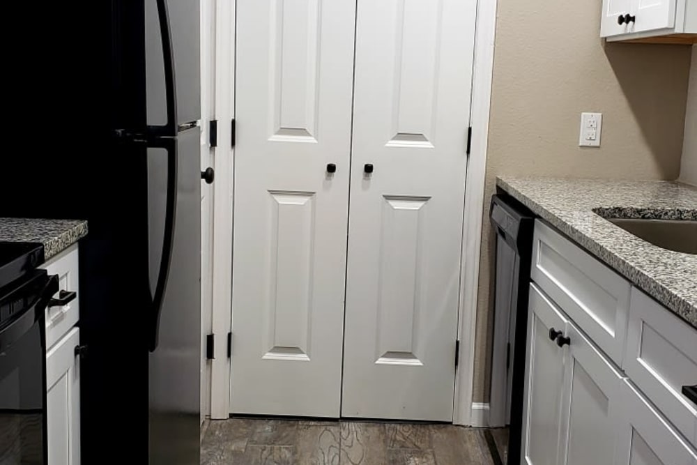 Kitchen with wood style flooring at Bateswood Manor in Houston, Texas