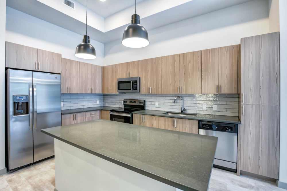 Kitchen with large island at The District Flats in West Palm Beach, Florida