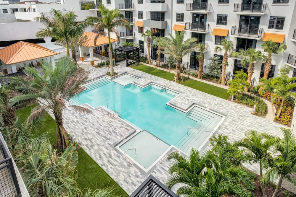 Resort-style swimming pool at The District Flats in West Palm Beach, Florida