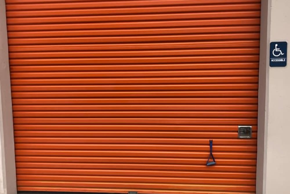 An orange storage unit door at Armor Self Storage in Sacramento, California