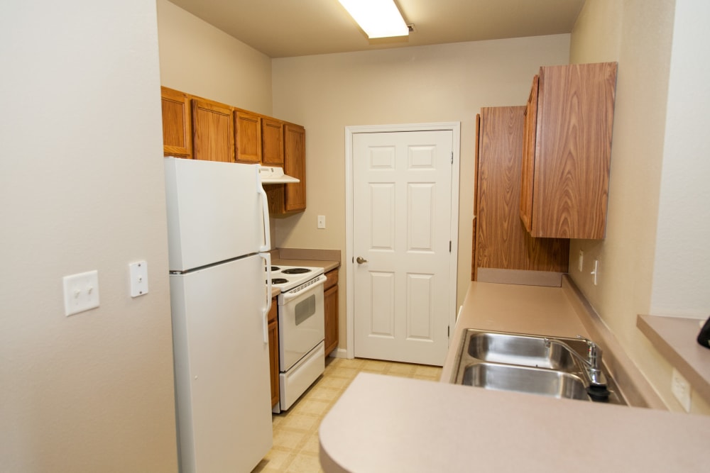 A kitchen with plenty of countertop space at O'Fallon Lakes in O'Fallon, Missouri