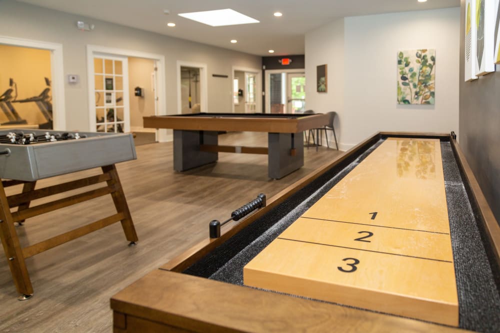 A clubhouse with billiards and foosball at Sunbrook Apartments in Saint Charles, Missouri