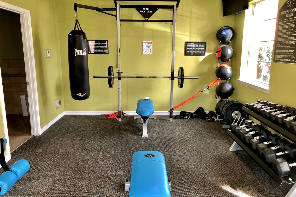 Enjoy apartments with a gym at The Abbey at Montgomery Park in Conroe, TX