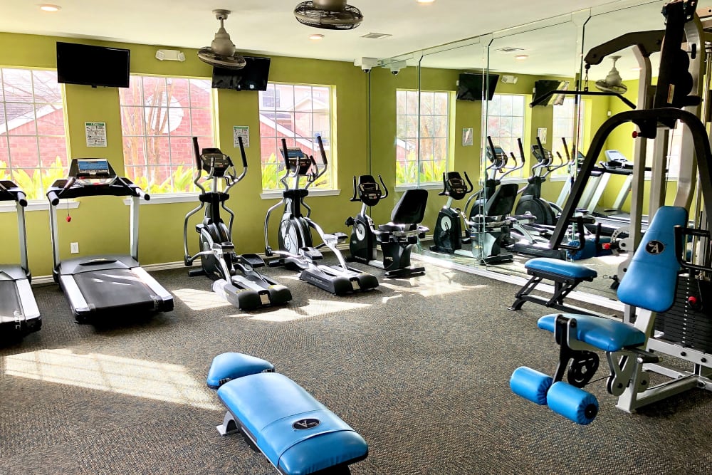 Enjoy apartments with a gym at The Abbey at Montgomery Park in Conroe, Texas