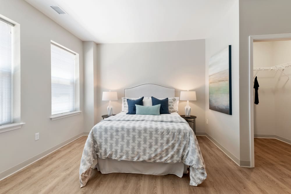 Bedroom with lots of natural light at The Apartments at Sharpe Square in Frederick, Maryland