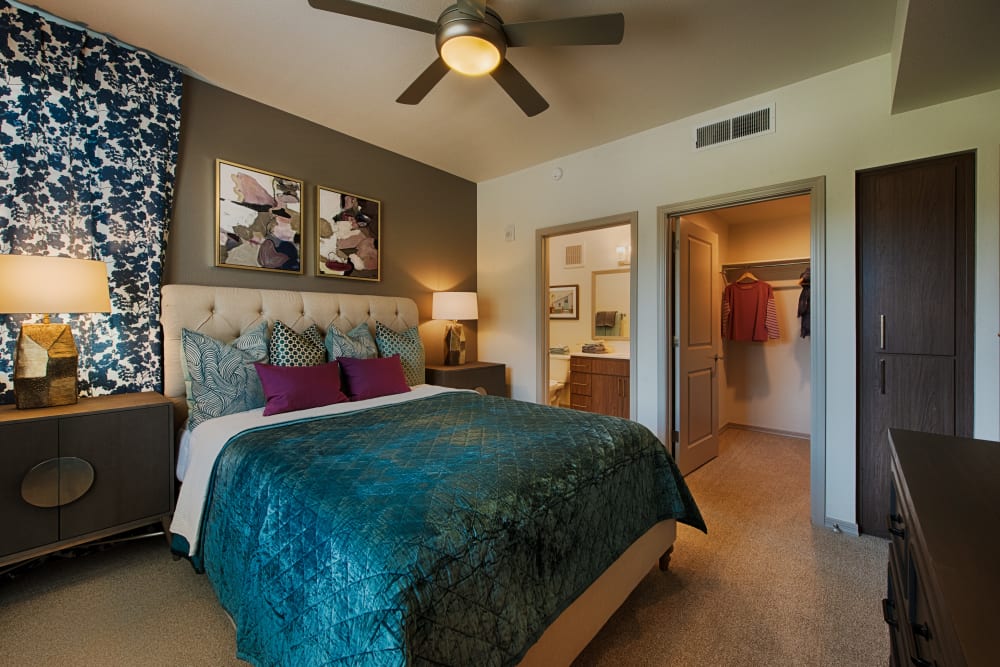Primary bedroom with a bathroom at Ocio Plaza Del Rio in Peoria, Arizona
