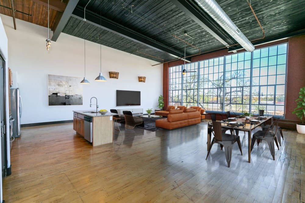 Loft style apartment with wood style flooring at The Lofts at Swift Mill in Columbus, Georgia