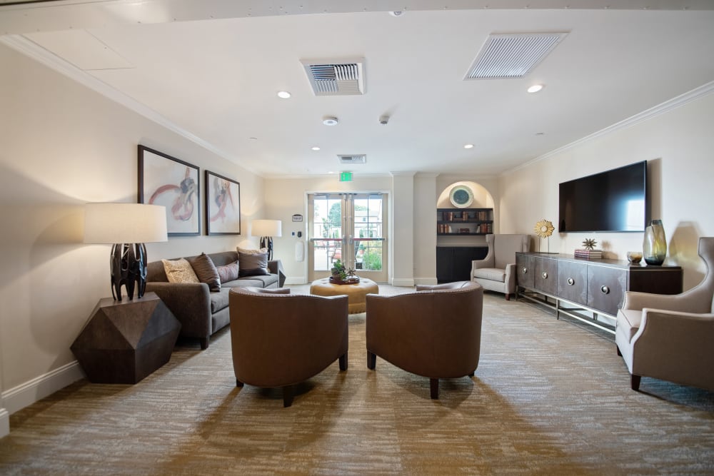 Lounge with chairs and a tv at Regency Palms Oxnard in Oxnard, California