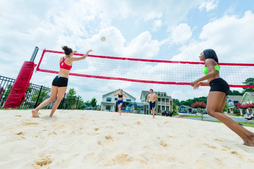 Residents playing some volleyball on the sand court at Ikon Athens in Athens, Georgia