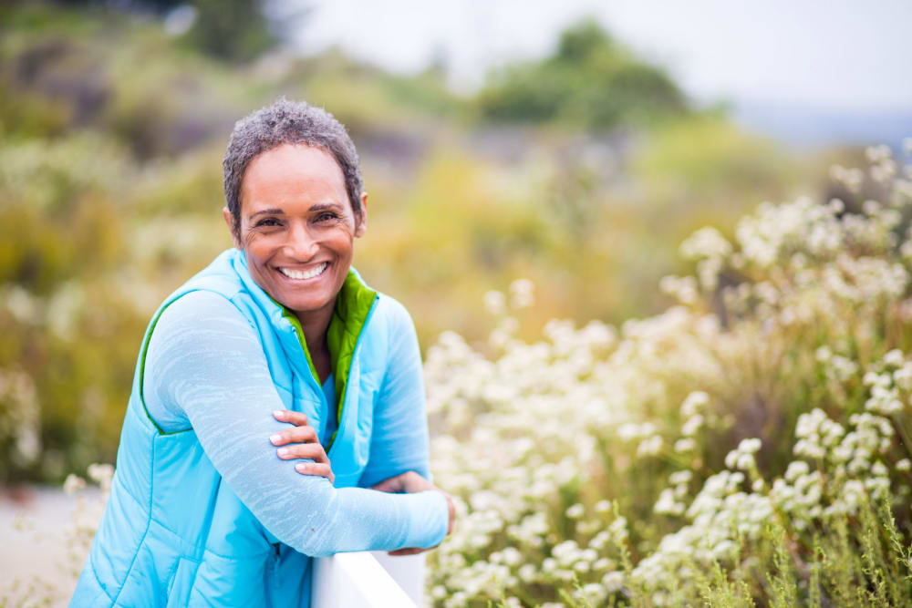 A resident smiling for the camera at Applewood Pointe of Westminster in Westminster, Colorado