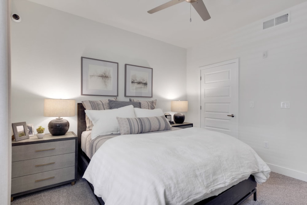 Plush carpeting and a ceiling fan in a model home's bedroom at Olympus Rodeo in Santa Fe, New Mexico