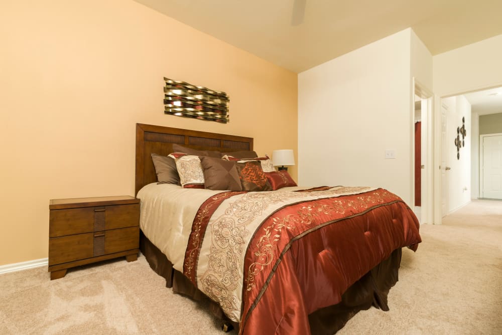 Spacious model bedroom with plush carpeting at Villa du Lac Apartment Homes in Slidell, Louisiana