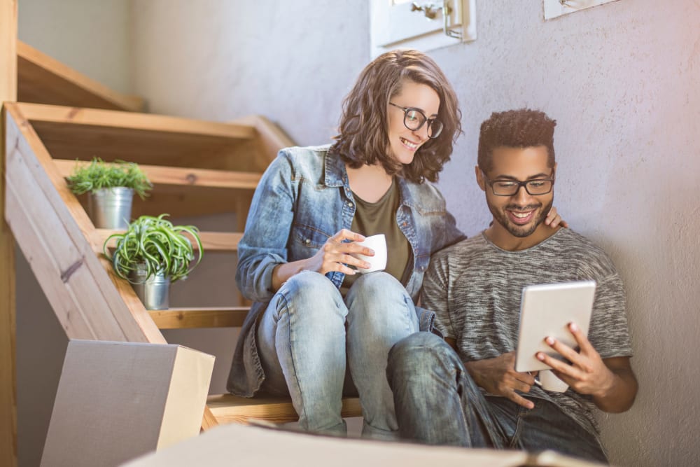 A couple paying their storage bill online in Sunnyvale, California at Devon Self Storage