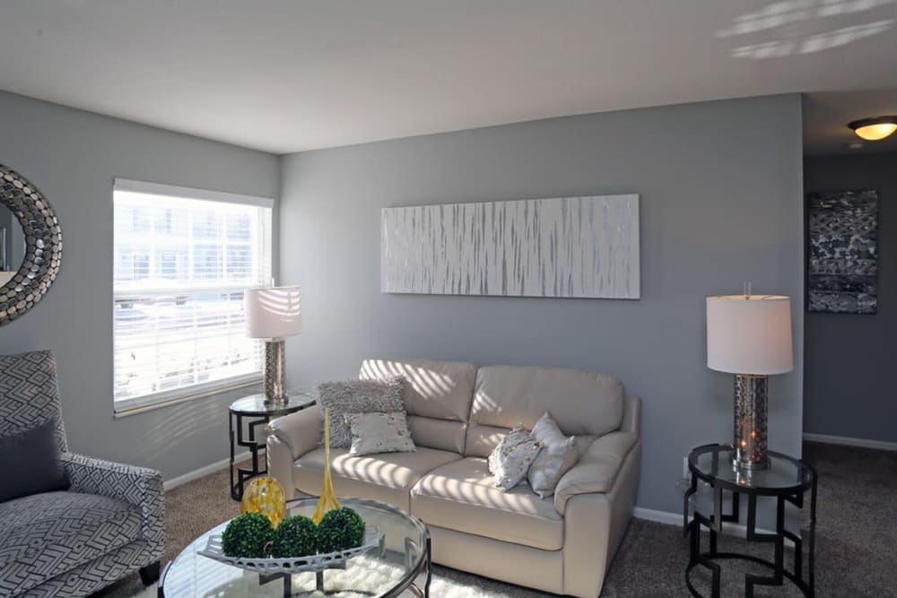 Naturally well-lit living room at Preserve at Sagebrook Apartment Homes in Miamisburg, Ohio