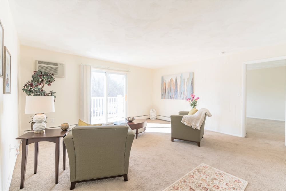 Well lit living room in apartment at { Park Village West in Westborough, Massachusetts
